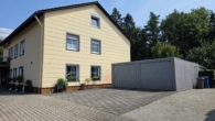 Außenansicht Garagen 1 - Charmantes Zweifamilienhaus mit großzügigem Garten, Obergeschoss vermietet