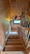 Treppe zum OG - Bezauberndes Niedrigenergie-Holzhaus mit Pool